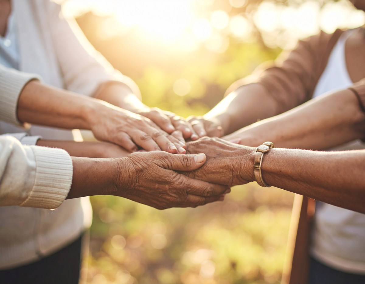 Many hands joined together.